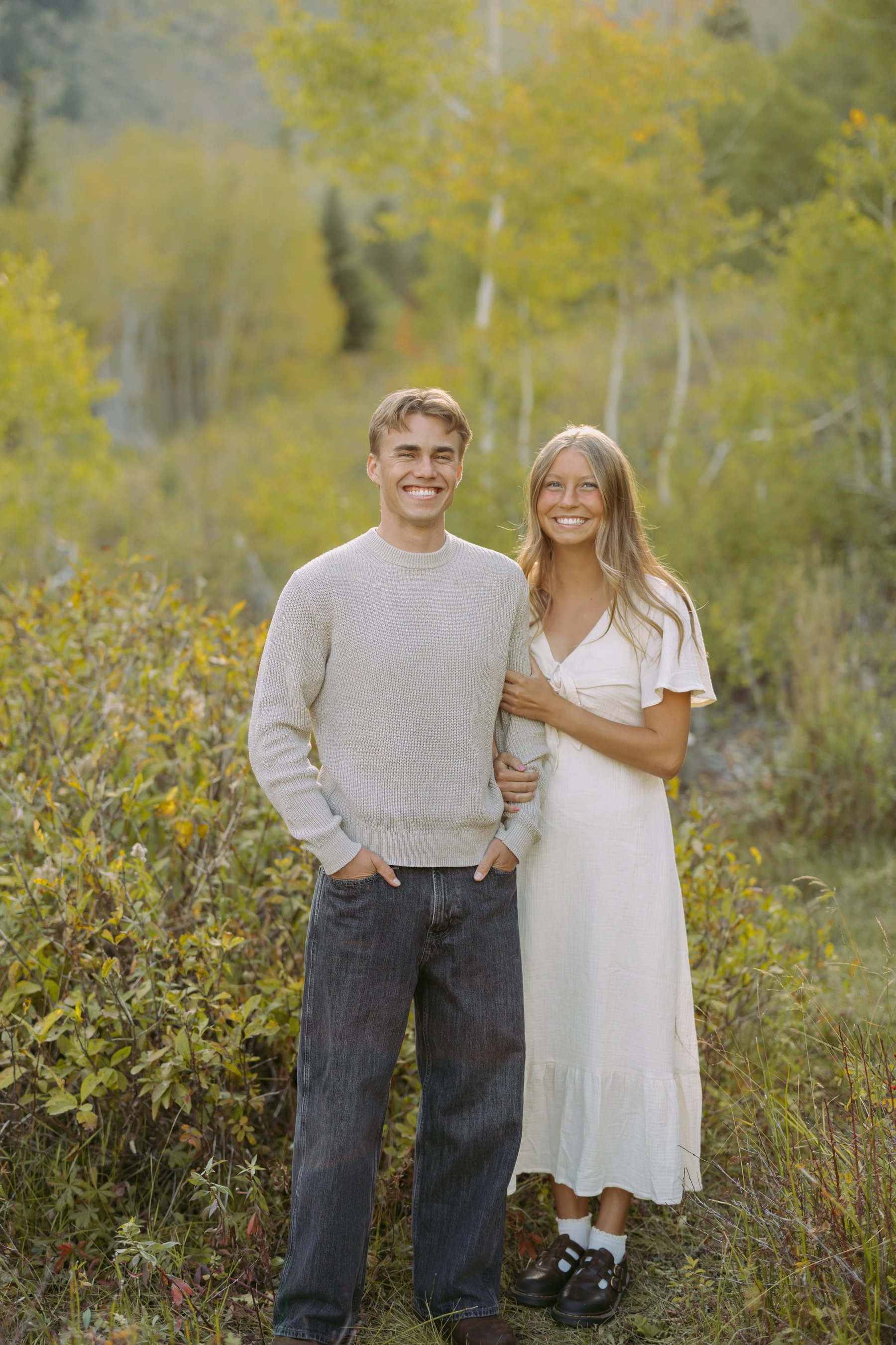 Carson with his wife, Courtney, outdoors in autumn